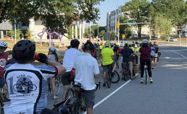 Create a 10-word scroll-stopping headline for: Durham Cyclists Mourn Traffic Deaths During Memorial Ride | Vibe NC