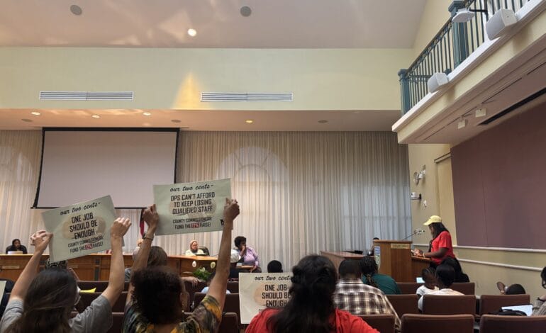 Create a 10-word scroll-stopping headline for: DAE Keeps Pressure on County to Raise Durham Public Schools Wages | Vibe NC