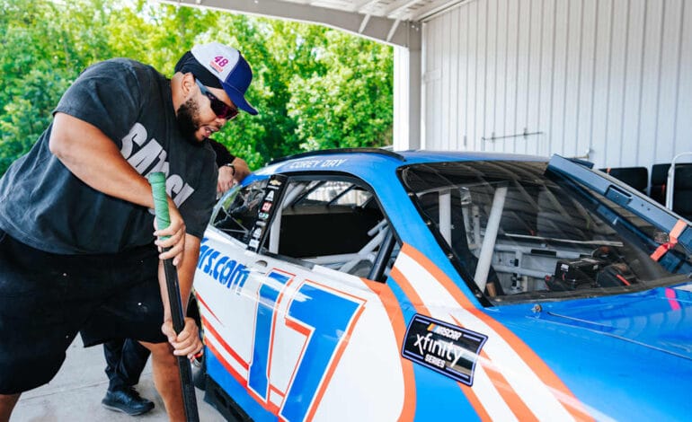 Create a 10-word scroll-stopping headline for: Panthers get first-hand look at what attention to detail and competitiveness bring to Hendrick Motorsports | Vibe NC