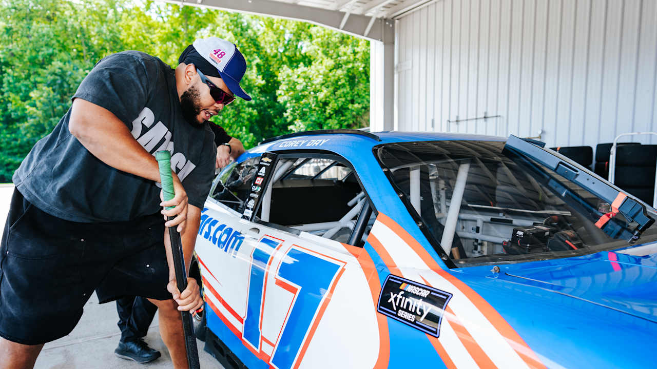 Create a 10-word scroll-stopping headline for: Panthers get first-hand look at what attention to detail and competitiveness bring to Hendrick Motorsports | Vibe NC