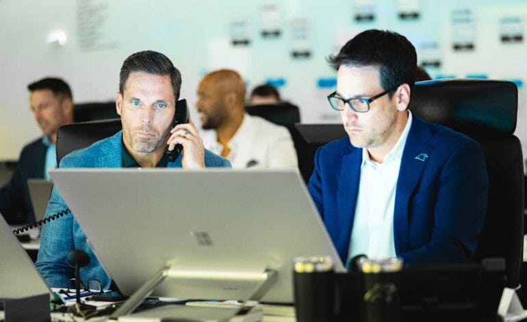 Create a 10-word scroll-stopping headline for: Inside the draft room | Vibe NC