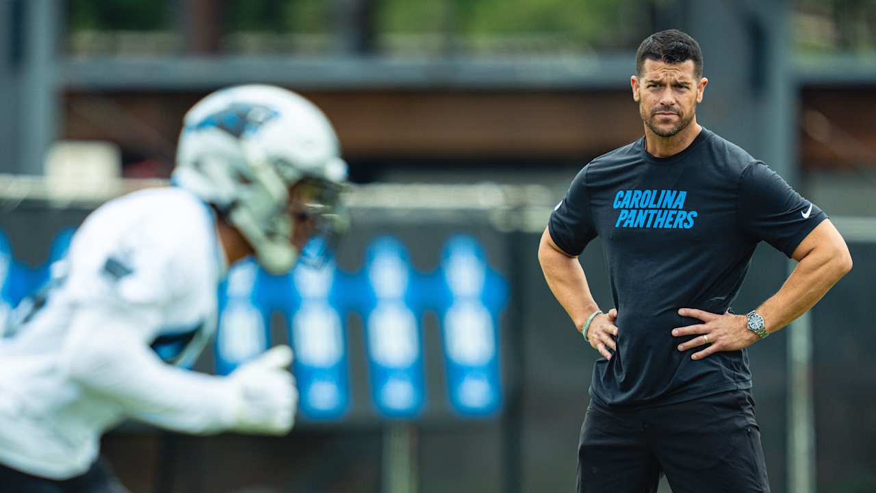 Create a 10-word scroll-stopping headline for: Panthers announce 2026 coaching staff | Vibe NC