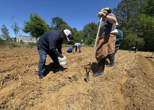 Create a 10-word scroll-stopping headline for: Migrant workers, allies prepare for hot summer | Vibe NC