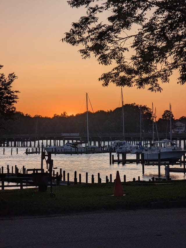 Create a 10-word scroll-stopping headline for: Inner Banks sunset 6/2 | Vibe NC
