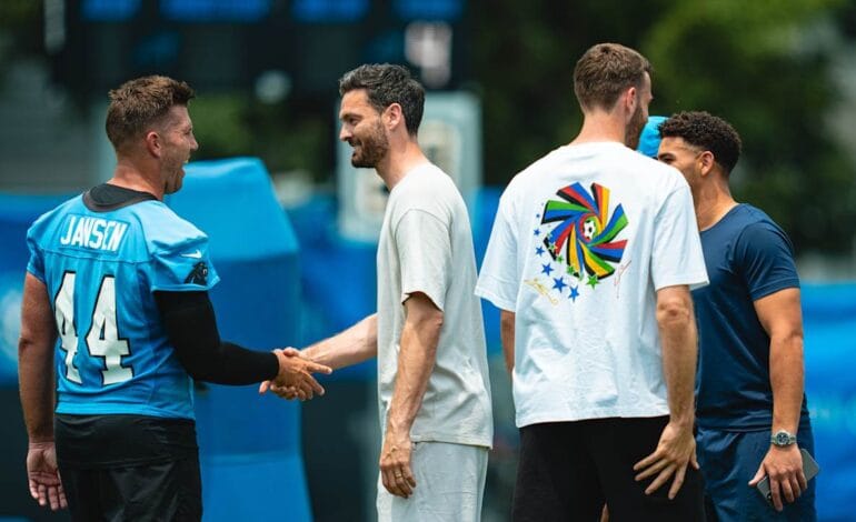 Create a 10-word scroll-stopping headline for: Scottish national team experiences American football with the Panthers | Vibe NC