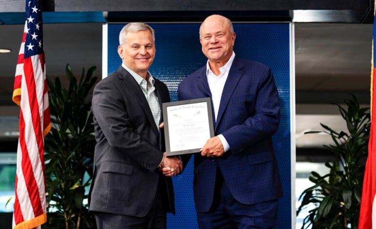Create a 10-word scroll-stopping headline for: David Tepper honored with Order of the Long Leaf Pine by Governor Josh Stein  | Vibe NC