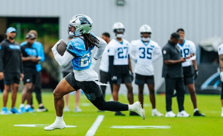 Create a 10-word scroll-stopping headline for: Jonathon Brooks bringing speed and competition to Panthers’ OTAs | Vibe NC