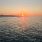 Create a 10-word scroll-stopping headline for: Sunrise on Emerald Isle (07/02/2026) | Vibe NC